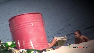 Young nudists fumble grease on each other's naked  bods