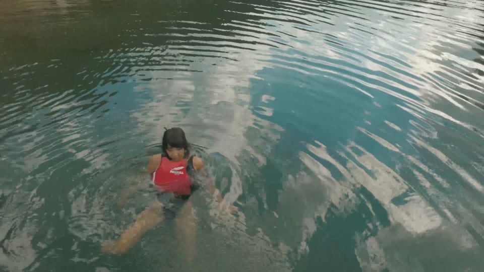 Daring Kiara Floating in Life Jacket in Alpine Lake