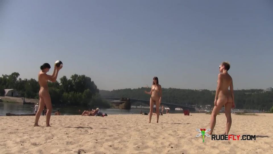 Slim young nudist smokes on a warm summer's day