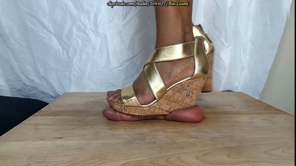 MERCILESSLY BEATEN BENEATH MY WEDGES [CLOSE-UP].