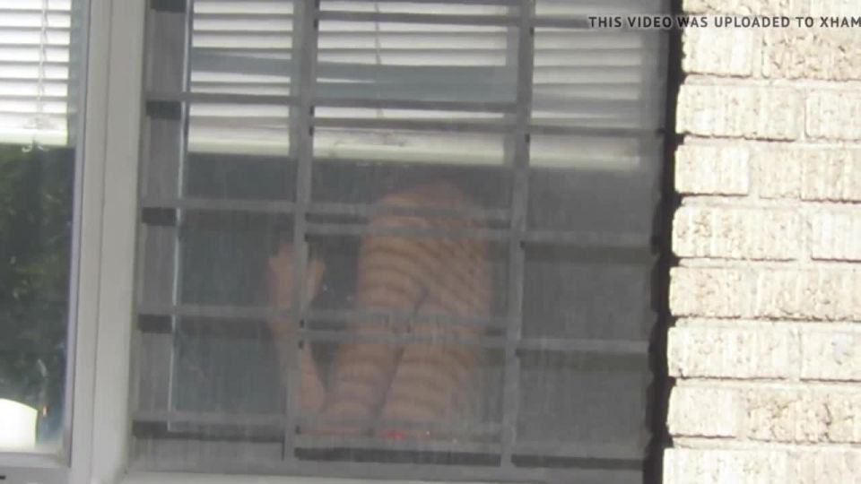 spying-across-the-street-neighbor-window_9820303_