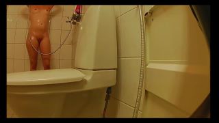 slim girl with shaved pussy taking a shower. hidden cam