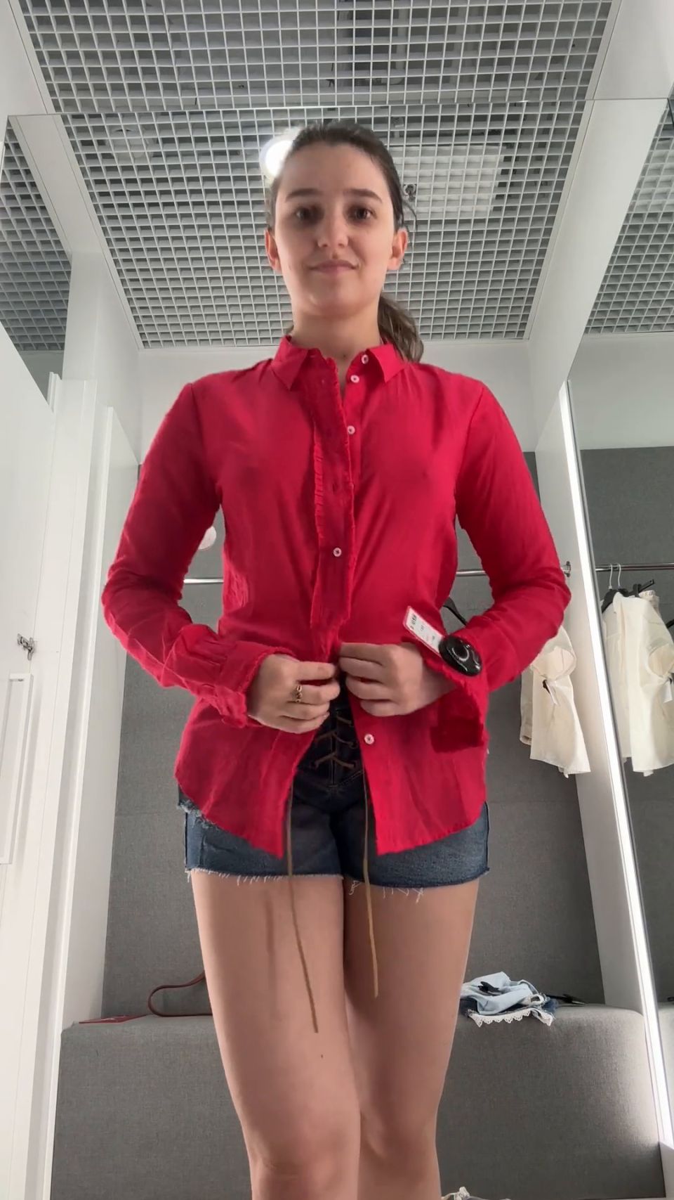 Undressing And Trying On Clothes In Changing Room.