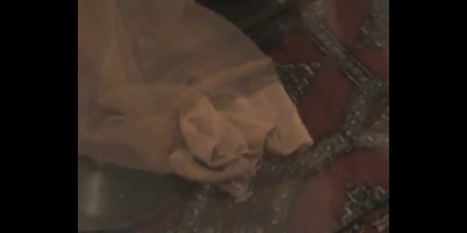 Kinky Cutie Part 2. Max continues to pay attention to Meesha's feet, then is ordered to dress her in her garters, nylons, and heels! She enjoys her domination very much, and treats herself to a cigarette.