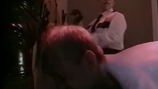 Policewoman and a Dominatrix Team up to Interrogate a Criminal.