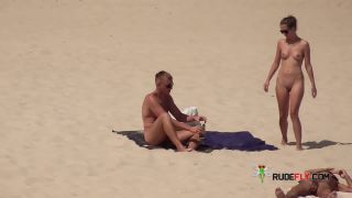 Dark haired naturist strand teen gets an all over  tan