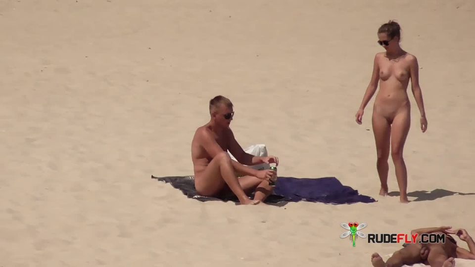 Dark haired naturist strand teen gets an all over  tan